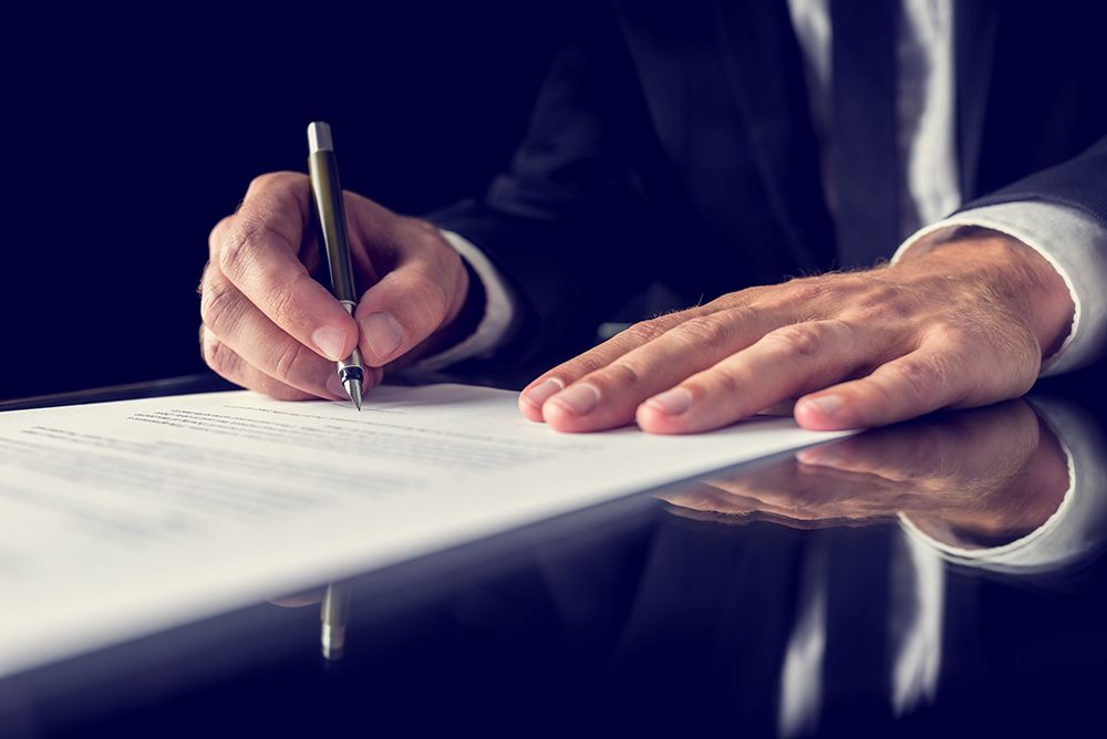 Real estate specialist signs a contract